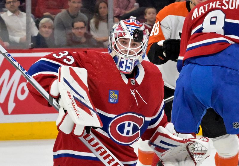 Apr 9, 2024; Montreal, Quebec, CAN; Montreal Canadiens goalie Sam Montembeault (35) makes a save against the Philadelphia Flyers during the first period at the Bell Centre. Mandatory Credit: Eric Bolte-USA TODAY Sports