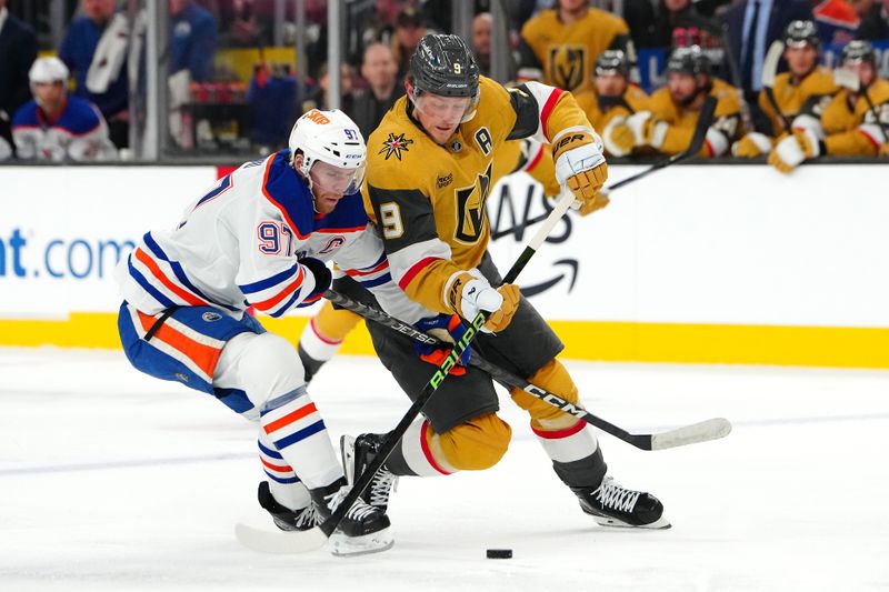 Dec 3, 2024; Las Vegas, Nevada, USA; Edmonton Oilers center Connor McDavid (97) defends against Vegas Golden Knights center Jack Eichel (9) during the second period at T-Mobile Arena. Mandatory Credit: Stephen R. Sylvanie-Imagn Images