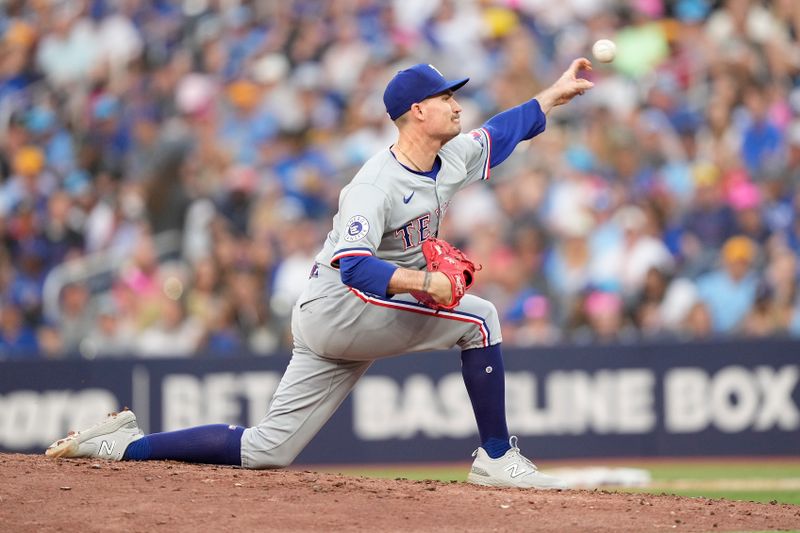 Jul 26, 2024; Toronto, Ontario, CAN; Texas Rangers starting pitcher Andrew Heaney (44) pitches to the Toronto Blue Jays during the second inning at Rogers Centre. Mandatory Credit: John E. Sokolowski-USA TODAY Sports