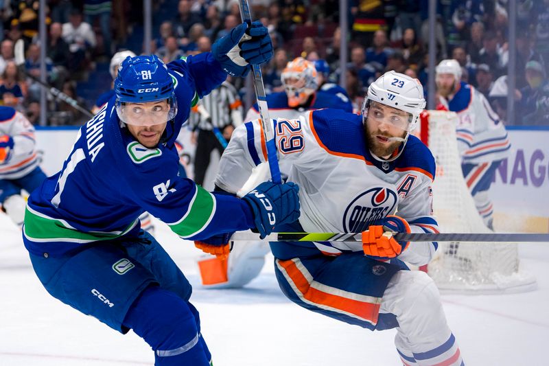 May 20, 2024; Vancouver, British Columbia, CAN; Vancouver Canucks forward Dakota Joshua (81) battles with Edmonton Oilers forward Leon Draisaitl (29) during the third period in game seven of the second round of the 2024 Stanley Cup Playoffs at Rogers Arena. Mandatory Credit: Bob Frid-USA TODAY Sports