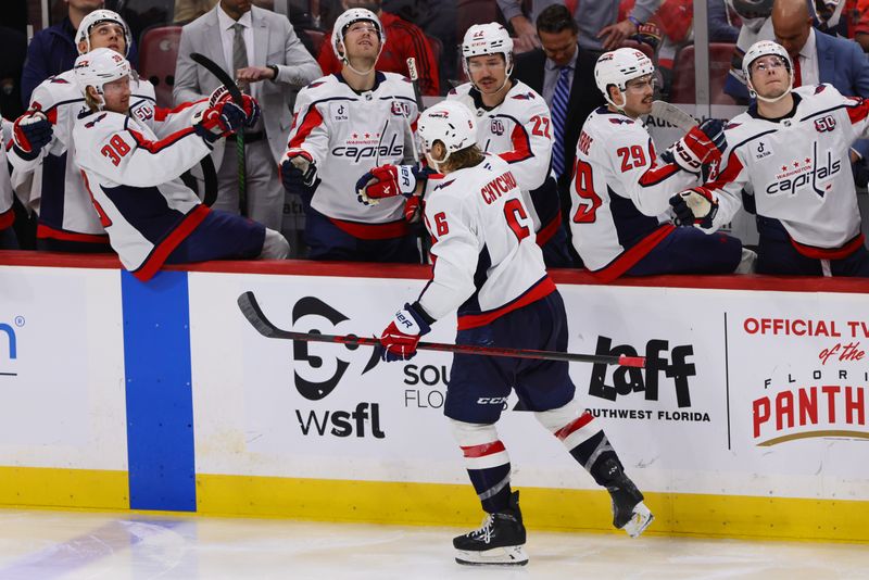 Nov 25, 2024; Sunrise, Florida, USA; Washington Capitals defenseman Jakob Chychrun (6) celebrates with teammates after scoring against the Florida Panthers during the third period at Amerant Bank Arena. Mandatory Credit: Sam Navarro-Imagn Images