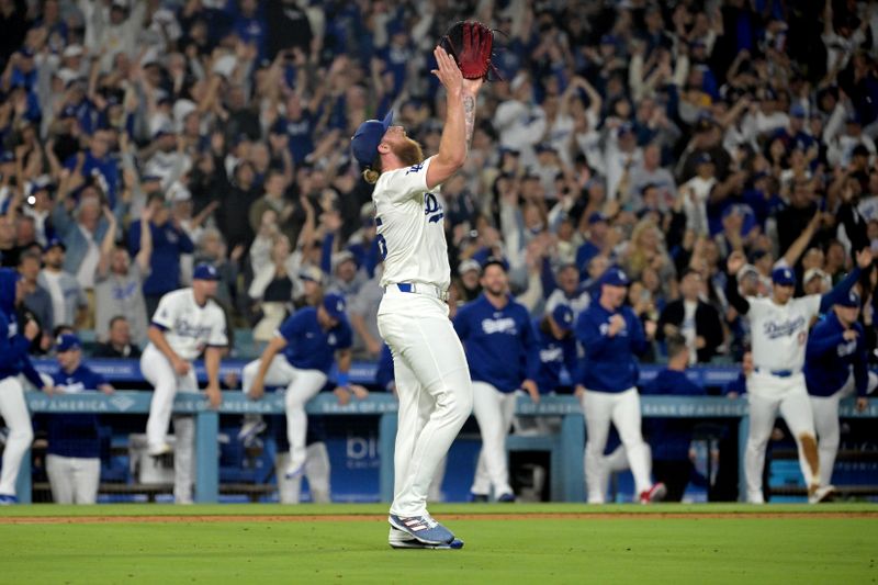 Sep 26, 2024; Los Angeles, California, USA;  Los Angeles Dodgers relief pitcher Michael Kopech (45) celebrates after clinching the National League West by defeating the San Diego Padres 7-2 at Dodger Stadium. Mandatory Credit: Jayne Kamin-Oncea-Imagn Images