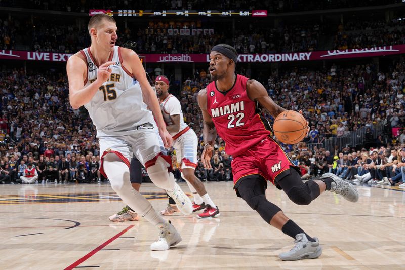 DENVER, CO - JUNE 12: Jimmy Butler #22 of the Miami Heat dribbles the ball during Game Five of the 2023 NBA Finals on June 12, 2023 at Ball Arena in Denver, Colorado. NOTE TO USER: User expressly acknowledges and agrees that, by downloading and or using this Photograph, user is consenting to the terms and conditions of the Getty Images License Agreement. Mandatory Copyright Notice: Copyright 2023 NBAE (Photo by Jesse D. Garrabrant/NBAE via Getty Images)