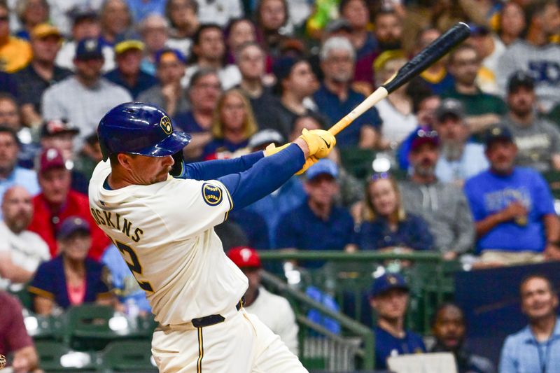 Sep 18, 2024; Milwaukee, Wisconsin, USA; Milwaukee Brewers first baseman Rhys Hoskins (12) hits a solo home run in the fifth inning against the Philadelphia Phillies at American Family Field. Mandatory Credit: Benny Sieu-Imagn Images