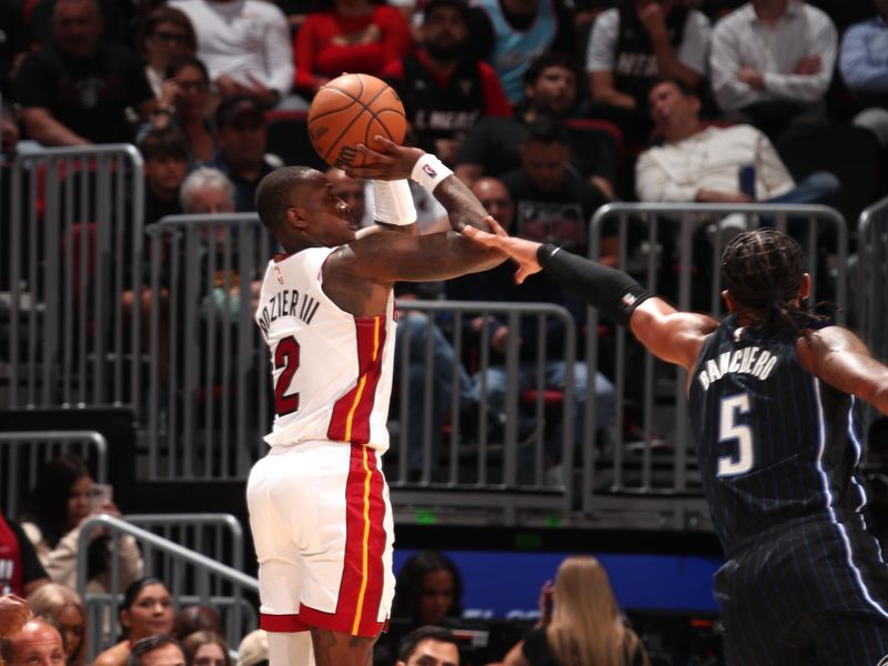 MIAMI, FL - OCTOBER 23: Terry Rozier #2 of the Miami Heat shoots a three point basket during the game against the Orlando Magic on October 23, 2024 at Kaseya Center in Miami, Florida. NOTE TO USER: User expressly acknowledges and agrees that, by downloading and or using this Photograph, user is consenting to the terms and conditions of the Getty Images License Agreement. Mandatory Copyright Notice: Copyright 2024 NBAE (Photo by Issac Baldizon/NBAE via Getty Images)