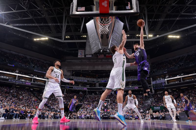 SACRAMENTO, CA - MARCH 12: Domantas Sabonis #10 of the Sacramento Kings drives to the basket during the game against the Milwaukee Bucks on March 12, 2024 at Golden 1 Center in Sacramento, California. NOTE TO USER: User expressly acknowledges and agrees that, by downloading and or using this Photograph, user is consenting to the terms and conditions of the Getty Images License Agreement. Mandatory Copyright Notice: Copyright 2024 NBAE (Photo by Rocky Widner/NBAE via Getty Images)