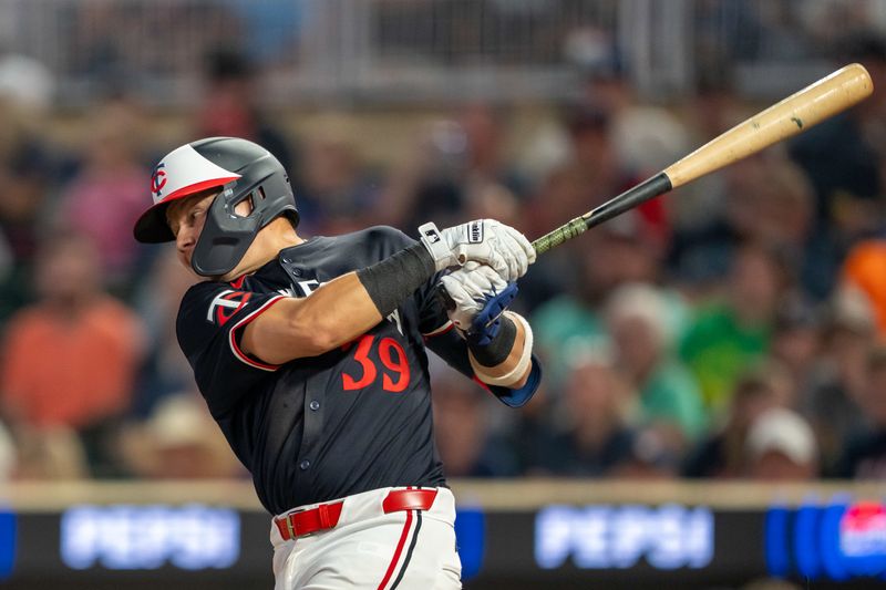 Jul 22, 2024; Minneapolis, Minnesota, USA; Minnesota Twins third baseman Diego A. Castillo (39) hits a ground rule double against the Philadelphia Phillies in the fifth inning at Target Field. Mandatory Credit: Jesse Johnson-USA TODAY Sports