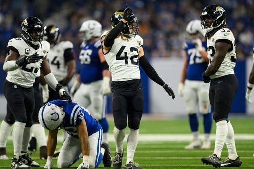 Jacksonville Jaguars safety Andrew Wingard (42) celebrates on the field during an NFL football game against the Indianapolis Colts, Sunday, Jan. 5, 2025, in Indianapolis. The Colts defeated the Jaguars 26-23. (AP Photo/Zach Bolinger)