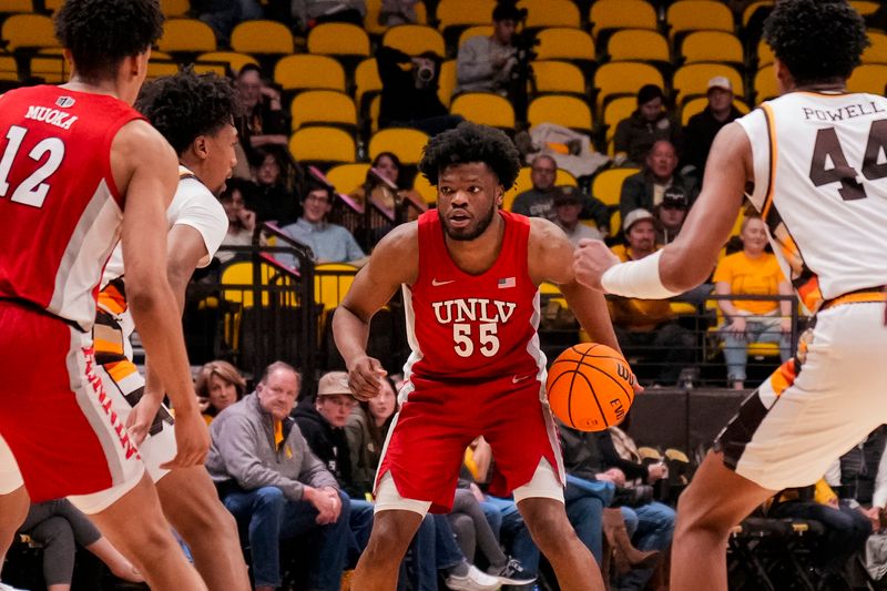 Feb 8, 2023; Laramie, Wyoming, USA; UNLV Runnin' Rebels guard EJ Harkless (55) looks to pass against the Wyoming Cowboys during the second half at Arena-Auditorium. Mandatory Credit: Troy Babbitt-USA TODAY Sports