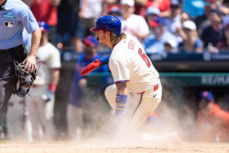 May 8, 2024; Philadelphia, Pennsylvania, USA; Philadelphia Phillies second base Bryson Stott (5) scores against the Toronto Blue Jays during the third inning at Citizens Bank Park. Mandatory Credit: Bill Streicher-USA TODAY Sports