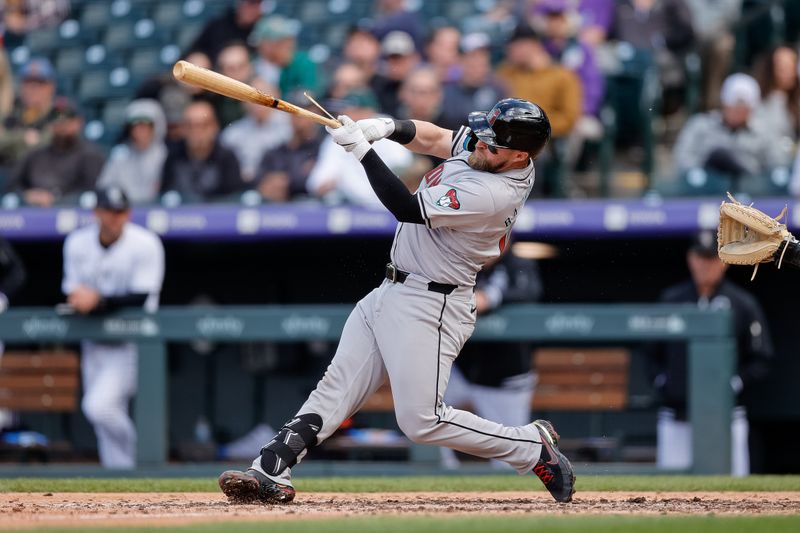 Apr 10, 2024; Denver, Colorado, USA; Arizona Diamondbacks catcher Tucker Barnhart (16) hits a single in the eighth inning against the Colorado Rockies at Coors Field. Mandatory Credit: Isaiah J. Downing-USA TODAY Sports