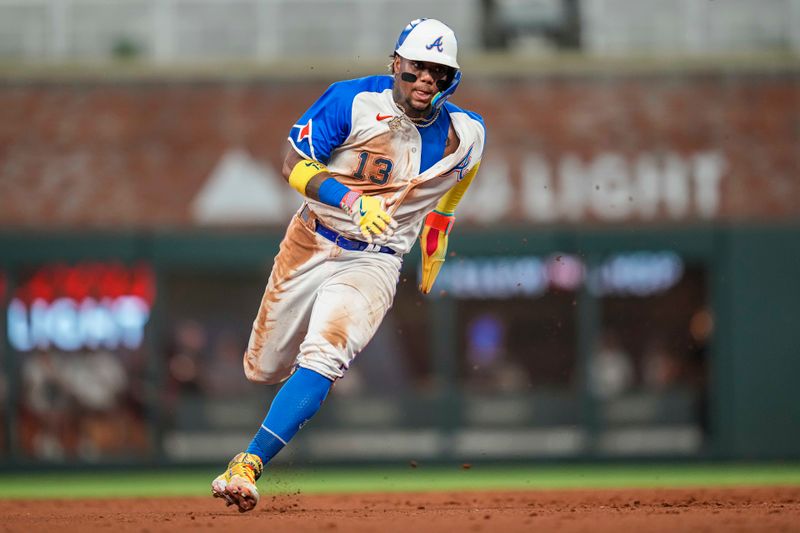 Jul 29, 2023; Cumberland, Georgia, USA; Atlanta Braves right fielder Ronald Acuna Jr. (13) runs against the Milwaukee Brewers during the eighth inning at Truist Park. Mandatory Credit: Dale Zanine-USA TODAY Sports