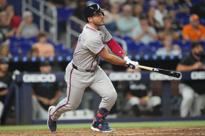 Sep 20, 2024; Miami, Florida, USA;  Atlanta Braves left fielder Ramon Laureano (18) hits a solo home run in the sixth inning against the Miami Marlins at loanDepot Park. Mandatory Credit: Jim Rassol-Imagn Images