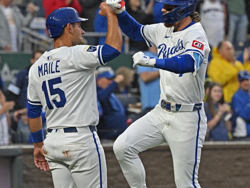 May 7, 2025; Kansas City, Missouri, USA;  Kansas City Royals shortstop Bobby Witt Jr. (7) celebrates with catcher Luke Maile (15) after hitting a two-run home run in the fifth inning against the Chicago White Sox at Kauffman Stadium. Mandatory Credit: Peter Aiken-Imagn Images