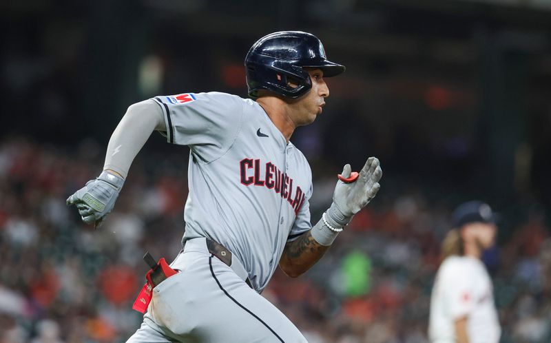 May 2, 2024; Houston, Texas, USA; Cleveland Guardians shortstop Brayan Rocchio (4) runs to first base on a double during the third inning against the Houston Astros at Minute Maid Park. Mandatory Credit: Troy Taormina-USA TODAY Sports