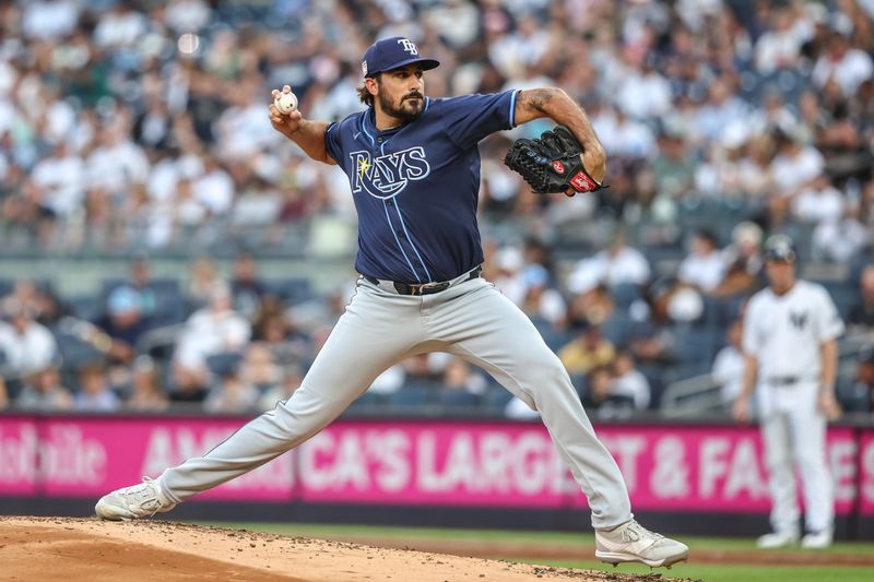 Jul 19, 2024; Bronx, New York, USA;  Tampa Bay Rays starting pitcher Zach Eflin (24) pitches in the first inning against the New York Yankees at Yankee Stadium. Mandatory Credit: Wendell Cruz-USA TODAY Sports