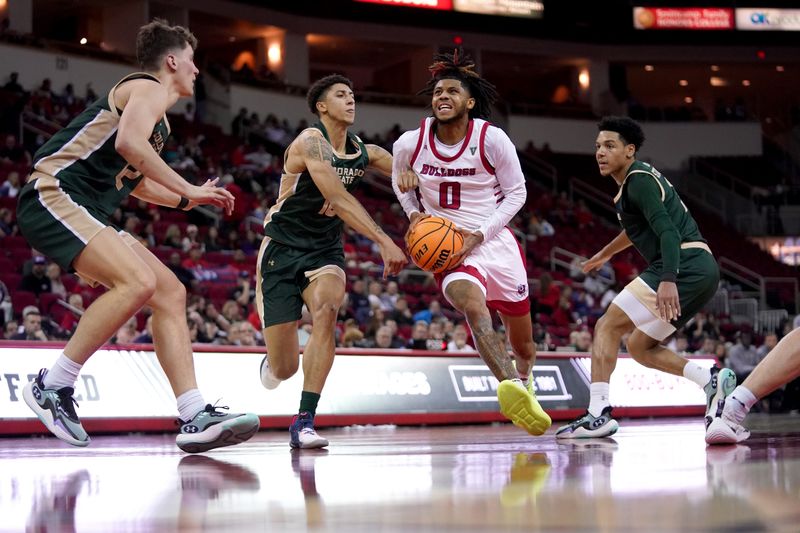 Feb 3, 2024; Fresno, California, USA; Fresno State Bulldogs Donavan Yap Jr. (0) drives past Colorado State Rams guard Nique Clifford (10) in the second half at the Save Mart Center. Mandatory Credit: Cary Edmondson-USA TODAY Sports