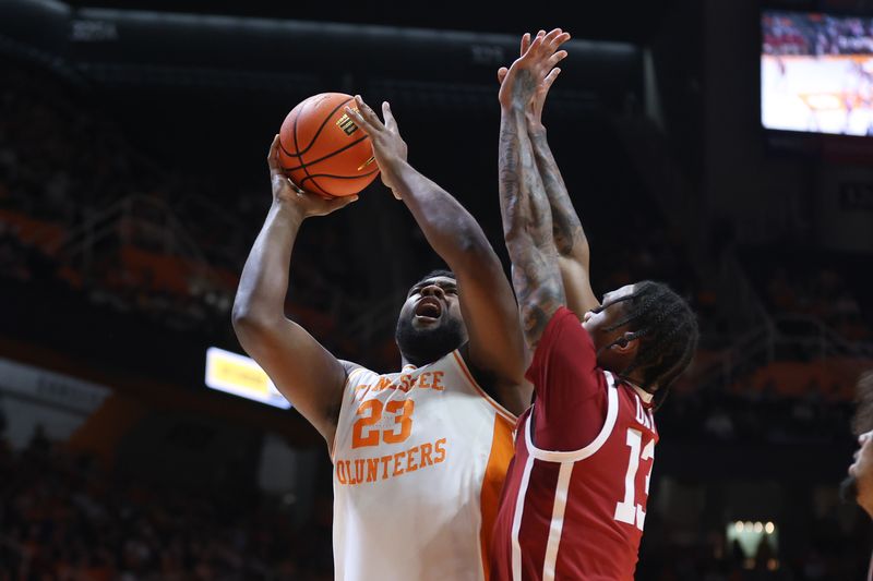 Feb 18, 2026; Knoxville, Tennessee, USA;  Tennessee Volunteers forward Jaylen Carey (23) goes to the basket against Oklahoma Sooners forward Tae Davis (13) during the first half at Thompson-Boling Arena at Food City Center. Mandatory Credit: Randy Sartin-Imagn Images