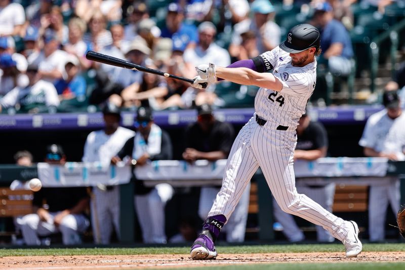 Jun 20, 2024; Denver, Colorado, USA; Colorado Rockies third baseman Ryan McMahon (24) hits a single in the fourth inning against the Los Angeles Dodgers at Coors Field. Mandatory Credit: Isaiah J. Downing-USA TODAY Sports