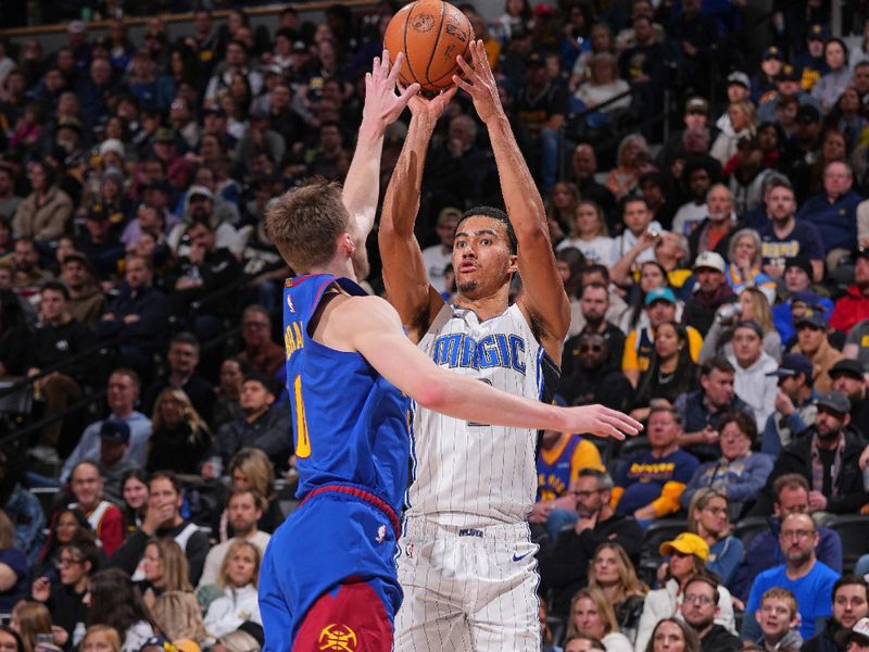 DENVER, CO - JANUARY 5: Caleb Houstan #2 of the Orlando Magic shoots the ball during the game against the Denver Nuggets on January 5, 2024 at the Ball Arena in Denver, Colorado. NOTE TO USER: User expressly acknowledges and agrees that, by downloading and/or using this Photograph, user is consenting to the terms and conditions of the Getty Images License Agreement. Mandatory Copyright Notice: Copyright 2024 NBAE (Photo by Bart Young/NBAE via Getty Images)