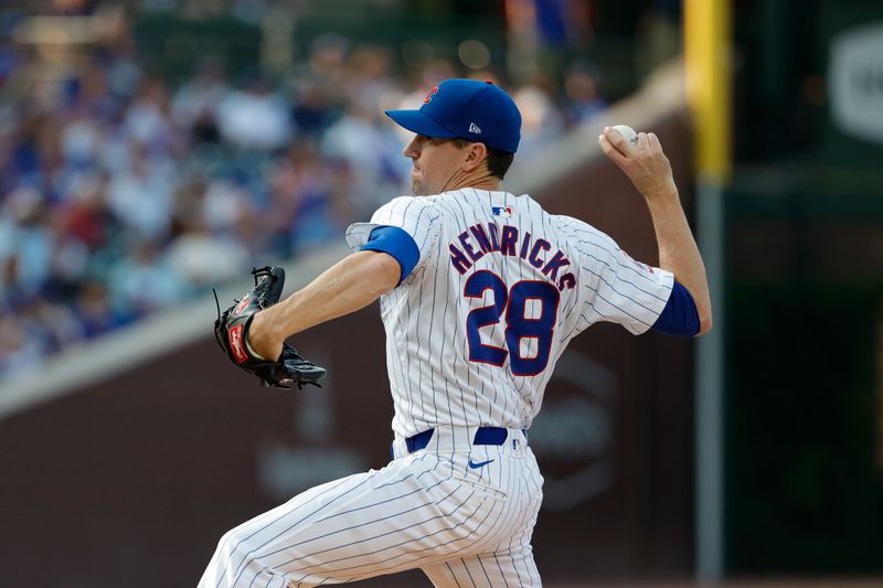 Jul 20, 2024; Chicago, Illinois, USA; Chicago Cubs starting pitcher Kyle Hendricks (28) delivers against the Arizona Diamondbacks during the first inning at Wrigley Field. Mandatory Credit: Kamil Krzaczynski-USA TODAY Sports