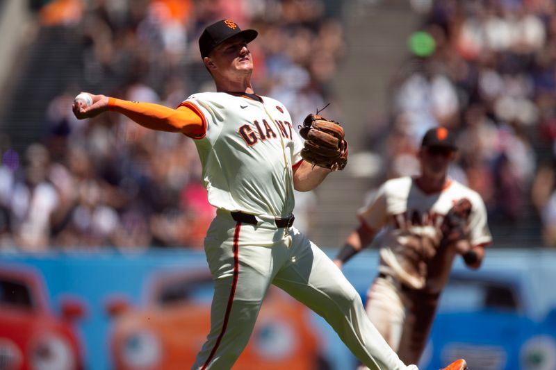 Aug 15, 2024; San Francisco, California, USA; San Francisco Giants third baseman Matt Chapman (26) throws to retires Atlanta Braves shortstop Orlando Arcia (not pictured) at first base during the second inning at Oracle Park. Mandatory Credit: D. Ross Cameron-USA TODAY Sports