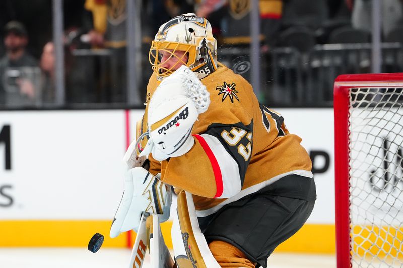 Oct 8, 2025; Las Vegas, Nevada, USA; Vegas Golden Knights goaltender Adin Hill (33) warms up before a game against the Los Angeles Kings at T-Mobile Arena. Mandatory Credit: Stephen R. Sylvanie-Imagn Images