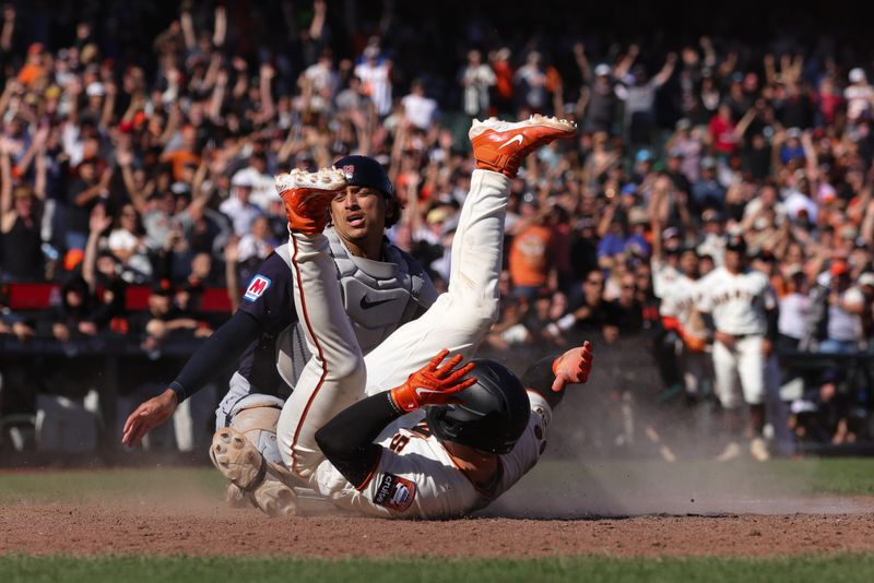 Sep 13, 2023; San Francisco, California, USA; San Francisco Giants catcher Patrick Bailey (14) scores the winning run during the tenth inning against the Cleveland Guardians at Oracle Park. Mandatory Credit: Sergio Estrada-USA TODAY Sports