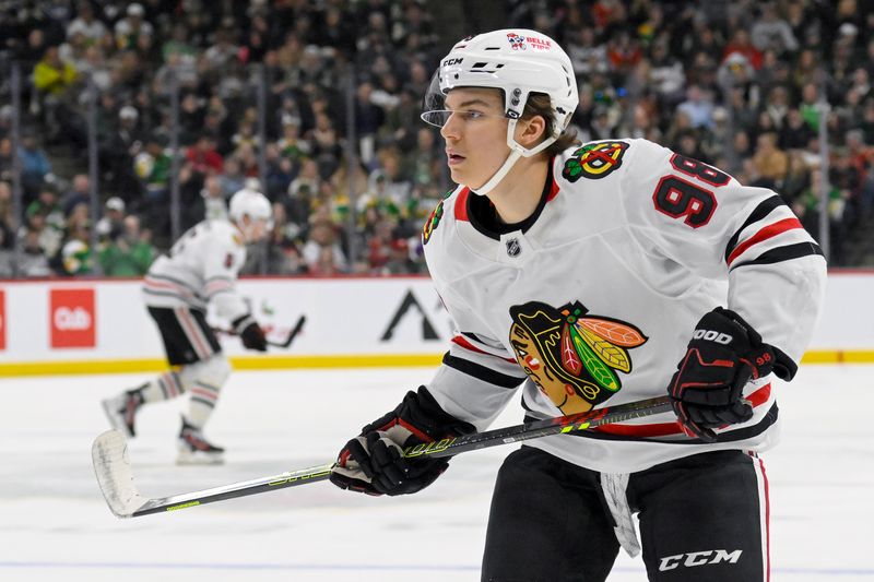 Nov 29, 2024; Saint Paul, Minnesota, USA;  Chicago Blackhawks forward Connor Bedard (98) tracks the play  against the Minnesota Wild during the third period at Xcel Energy Center. Mandatory Credit: Nick Wosika-Imagn Images