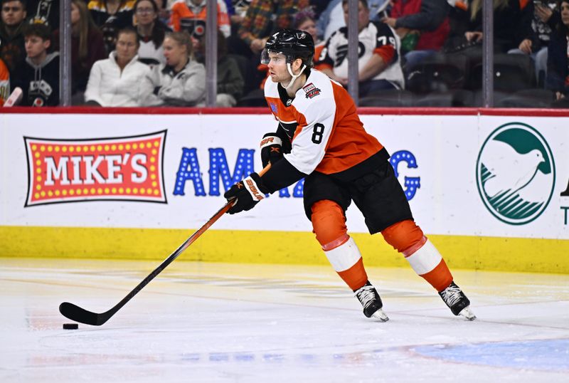 Jan 27, 2024; Philadelphia, Pennsylvania, USA; Philadelphia Flyers defenseman Cam York (8) controls the puck against the Boston Bruins in the third period at Wells Fargo Center. Mandatory Credit: Kyle Ross-USA TODAY Sports