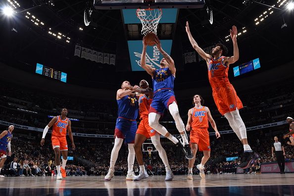 DENVER, CO - DECEMBER 16: Michael Porter Jr. #1 of the Denver Nuggets drives to the basket during the gameagainst the Oklahoma City Thunder on December 16, 2023 at the Ball Arena in Denver, Colorado. NOTE TO USER: User expressly acknowledges and agrees that, by downloading and/or using this Photograph, user is consenting to the terms and conditions of the Getty Images License Agreement. Mandatory Copyright Notice: Copyright 2023 NBAE (Photo by Garrett Ellwood/NBAE via Getty Images)