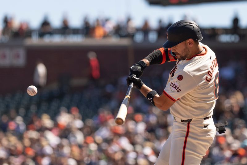 Sep 5, 2024; San Francisco, California, USA;  San Francisco Giants outfielder Michael Conforto (8) hits a double during the sixth inning against the Arizona Diamondbacks at Oracle Park. Mandatory Credit: Stan Szeto-Imagn Images