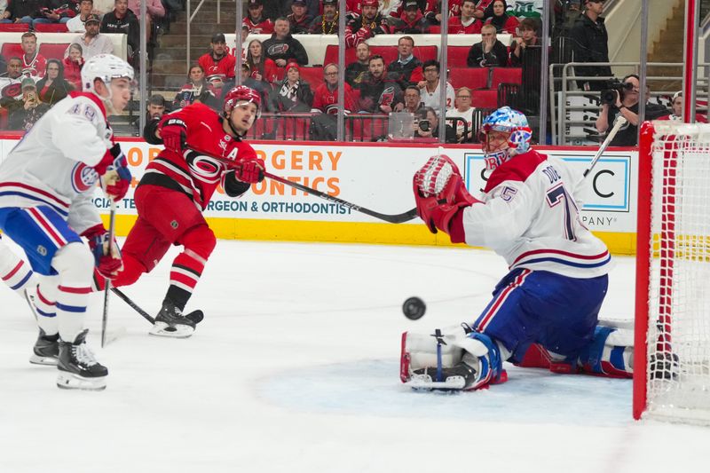 Mar 29, 2026; Raleigh, North Carolina, USA; Carolina Hurricanes center Sebastian Aho (20) misses on his shot attempt against Montreal Canadiens goaltender Jakub Dobes (75) during the third period at Lenovo Center. Mandatory Credit: James Guillory-Imagn Images Mar 29, 2026; Raleigh, North Carolina, USA; Carolina Hurricanes center Sebastian Aho (20) misses on his shot attempt against Montreal Canadiens goaltender Jakub Dobes (75) during the third period at Lenovo Center. Mandatory Credit: James Guillory-Imagn Images