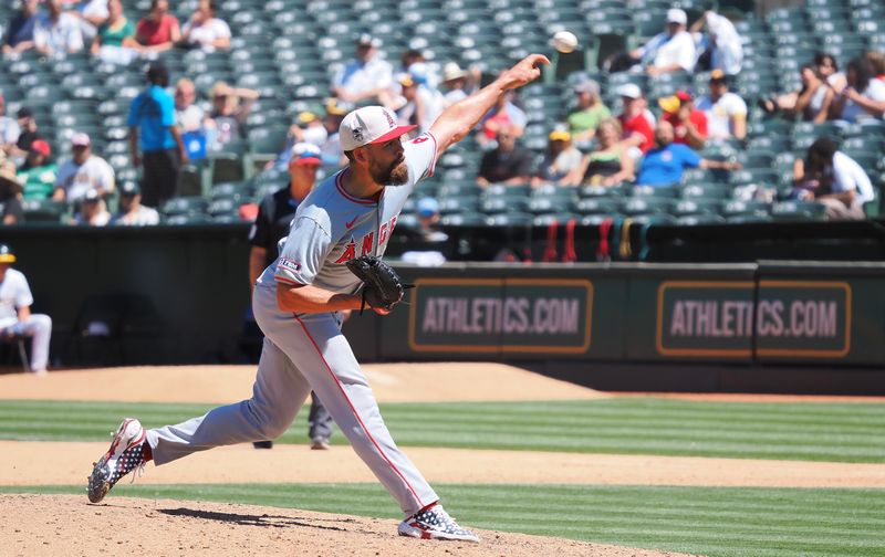 Jul 4, 2024; Oakland, California, USA; Los Angeles Angels relief pitcher Matt Moore (55) pitches the ball against the Oakland Athletics during the sixth inning at Oakland-Alameda County Coliseum. Mandatory Credit: Kelley L Cox-USA TODAY Sports