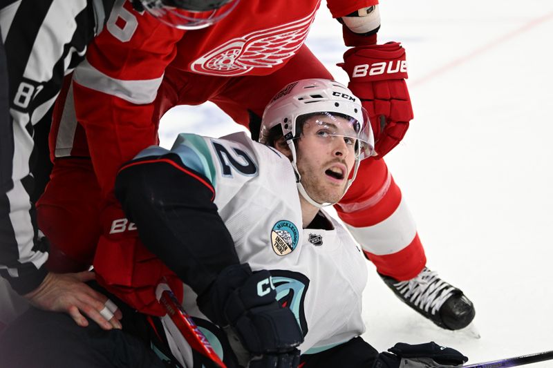 Oct 24, 2023; Detroit, Michigan, USA; Detroit Red Wings defenseman Jake Walman (96) (top) and Seattle Kraken left wing Tye Kartye (52) get separated after fighting in the first period at Little Caesars Arena. Mandatory Credit: Lon Horwedel-USA TODAY Sports