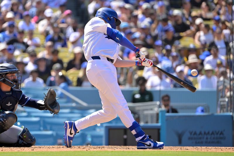 Aug 25, 2024; Los Angeles, California, USA;  Los Angeles Dodgers catcher Hunter Feduccia (67) singles for his first MLB hit in the seventh inning against the Tampa Bay Rays at Dodger Stadium. Mandatory Credit: Jayne Kamin-Oncea-USA TODAY Sports