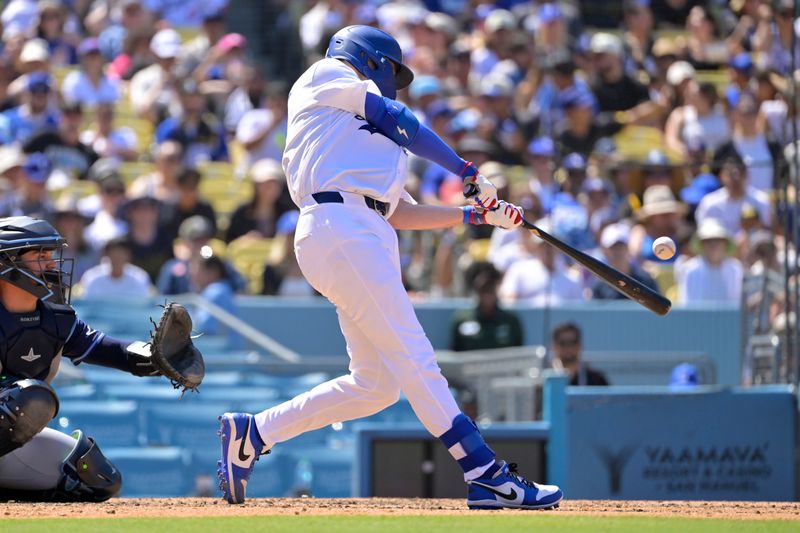 Aug 25, 2024; Los Angeles, California, USA;  Los Angeles Dodgers catcher Hunter Feduccia (67) singles for his first MLB hit in the seventh inning against the Tampa Bay Rays at Dodger Stadium. Mandatory Credit: Jayne Kamin-Oncea-USA TODAY Sports