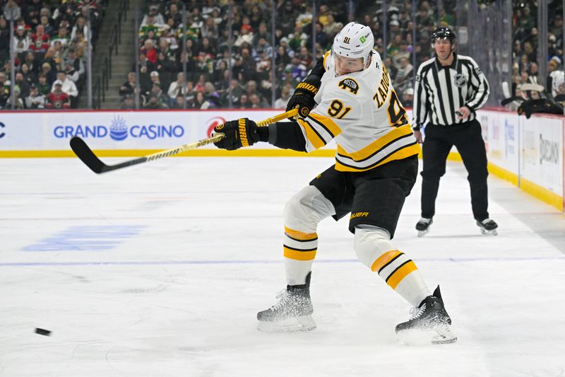 Dec 14, 2025; Saint Paul, Minnesota, USA;  Boston Bruins defensemen Nikita Zadorov (91) shoots the puck against the Minnesota Wild during the first period at Grand Casino Arena. Mandatory Credit: Nick Wosika-Imagn Images