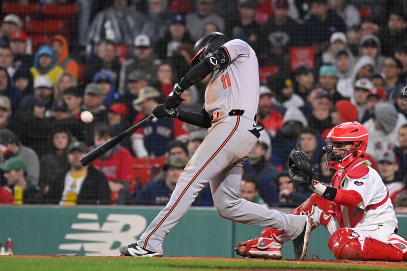 Apr 11, 20024; Boston, Massachusetts, USA; Baltimore Orioles third baseman Jordan Westburg (11) bats against the Boston Red Sox during the seventh inning at Fenway Park. Mandatory Credit: Eric Canha-USA TODAY Sports