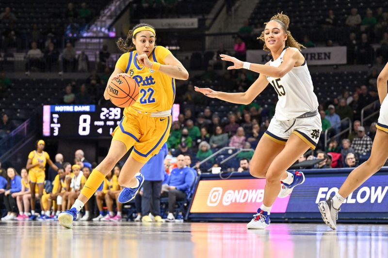 Feb 9, 2023; South Bend, Indiana, USA; Pittsburgh Panthers forward Gabby Hutcherson (22) dribbles as Notre Dame Fighting Irish forward Nat Marshall (15) defends in the first half at the Purcell Pavilion. Mandatory Credit: Matt Cashore-USA TODAY Sports