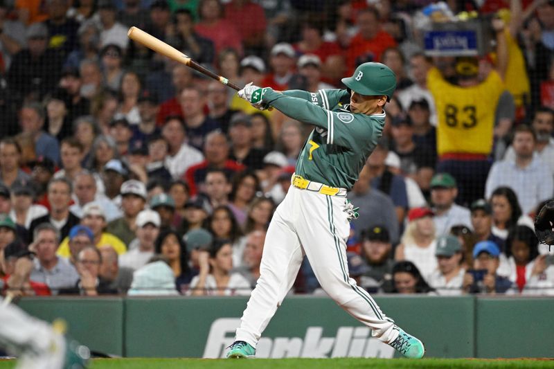 Sep 26, 2025; Boston, Massachusetts, USA; Boston Red Sox designated hitter Masataka Yoshida (7) hits a one run RBI single during the fourth inning against the Detroit Tigers at Fenway Park. Mandatory Credit: Eric Canha-Imagn Images