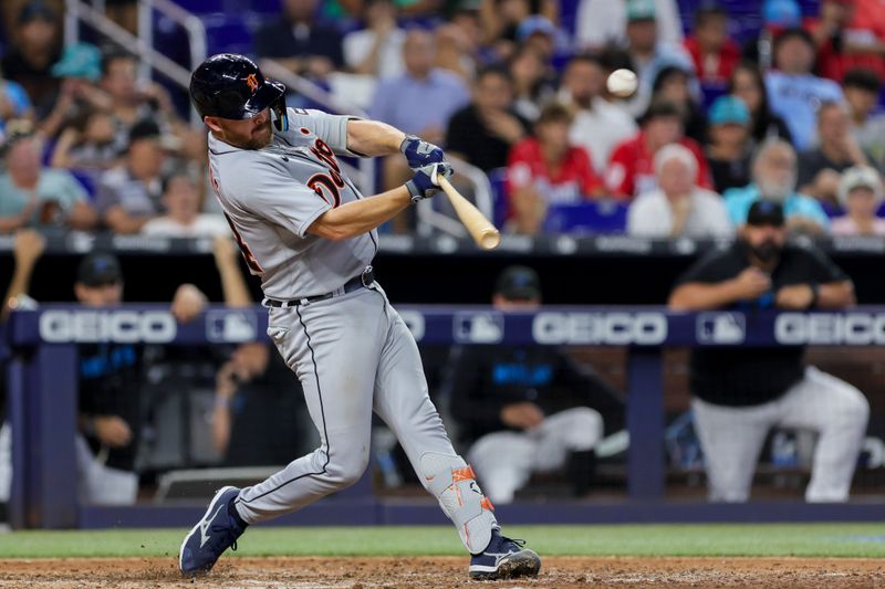 Jul 30, 2023; Miami, Florida, USA; Detroit Tigers catcher Jake Rogers (34) hits a double against the Miami Marlins during the seventh inning at loanDepot Park. Mandatory Credit: Sam Navarro-USA TODAY Sports