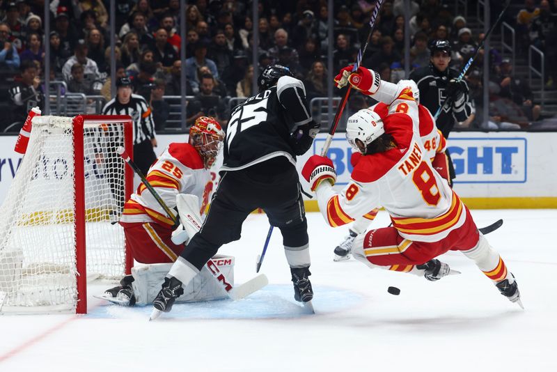 Dec 23, 2023; Los Angeles, California, USA; Calgary Flames defenseman Chris Tanev (8) trips during the second period against the Los Angeles Kings at Crypto.com Arena. Mandatory Credit: Jessica Alcheh-USA TODAY Sports