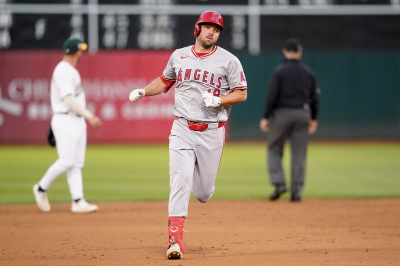 Jul 19, 2024; Oakland, California, USA; Los Angeles Angels first baseman Nolan Schanuel (18) jogs towards third base after hitting a home run against the Oakland Athletics in the sixth inning at Oakland-Alameda County Coliseum. Mandatory Credit: Cary Edmondson-USA TODAY Sports