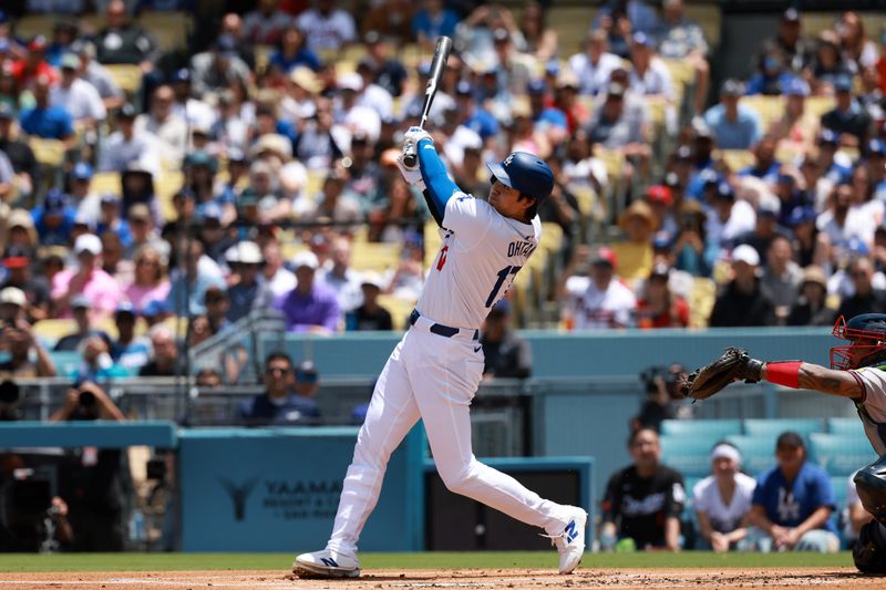 May 5, 2024; Los Angeles, California, USA;  Los Angeles Dodgers designated hitter Shohei Ohtani (17) hits a home run during the first inning against the Atlanta Braves at Dodger Stadium. Mandatory Credit: Kiyoshi Mio-USA TODAY Sports