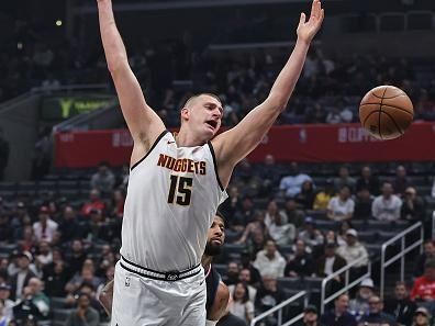 LOS ANGELES, CALIFORNIA - DECEMBER 06: Nikola Jokic #15 of the Denver Nuggets reacts as he is blocked by Paul George #13 of the Los Angeles Clippers during a game at Crypto.com Arena on December 06, 2023 in Los Angeles, California. NOTE TO USER: User expressly acknowledges and agrees that, by downloading and or using this photograph, User is consenting to the terms and conditions of the Getty Images License Agreement. (Photo by Michael Owens/Getty Images)