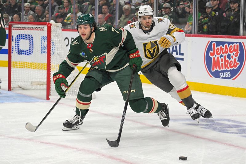 May 1, 2025; Saint Paul, Minnesota, USA;  Minnesota Wild defenseman Brock Faber (7) controls the puck as Vegas Golden Knights forward Brett Howden (21) gives chase during the third period in game six of the first round of the 2025 Stanley Cup Playoffs at Xcel Energy Center. Mandatory Credit: Nick Wosika-Imagn Images