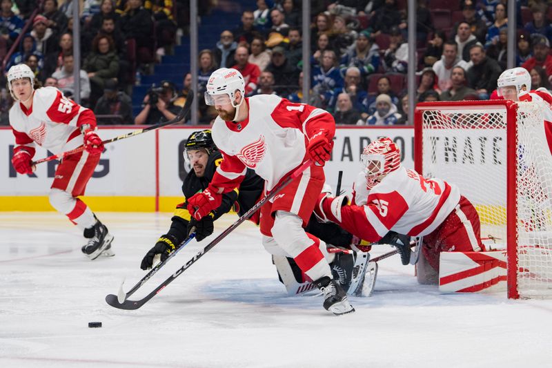 Feb 13, 2023; Vancouver, British Columbia, CAN; Vancouver Canucks forward Conor Garland (8) and Detroit Red Wings defenseman Filip Hronek (17) battle for the rebound as goalie Ville Husso (35) looks on in the third period at Rogers Arena. Red Wings won 6-1. Mandatory Credit: Bob Frid-USA TODAY Sports