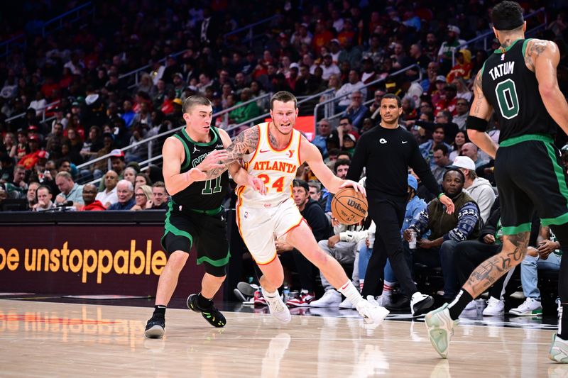 ATLANTA, GA - NOVEMBER 4: Garrison Mathews #24 of the Atlanta Hawks handles the ball during the game against the Boston Celtics on November 4, 2024 at State Farm Arena in Atlanta, Georgia.  NOTE TO USER: User expressly acknowledges and agrees that, by downloading and/or using this Photograph, user is consenting to the terms and conditions of the Getty Images License Agreement. Mandatory Copyright Notice: Copyright 2024 NBAE (Photo by Adam Hagy/NBAE via Getty Images)