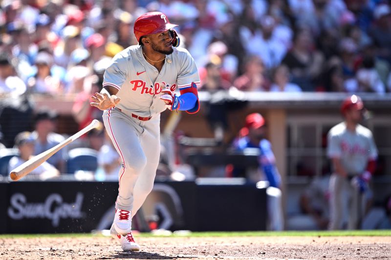 Apr 28, 2024; San Diego, California, USA; Philadelphia Phillies center fielder Johan Rojas (18) tosses his bat after hitting an RBI double against the San Diego Padres during the eighth inning at Petco Park. Mandatory Credit: Orlando Ramirez-USA TODAY Sports